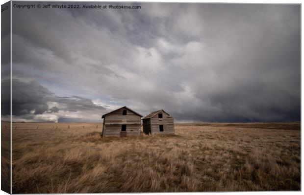 Abandoned farm buildings in Alberta Canvas Print by Jeff Whyte