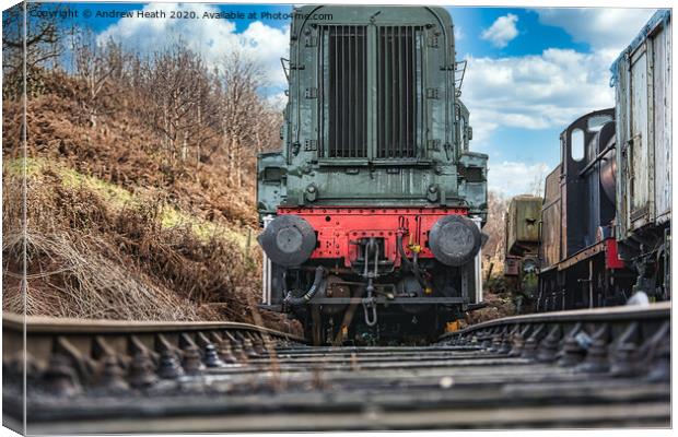 Clickerty clack a train on a track Canvas Print by Andrew Heath
