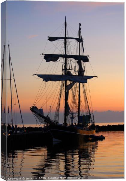Silhouetted Sunset Tall Ship Canvas Print by Imladris 
