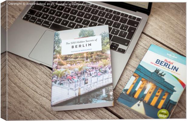 Planning a trip to Berlin with laptop on wooden table and travel guides Canvas Print by Kristof Bellens