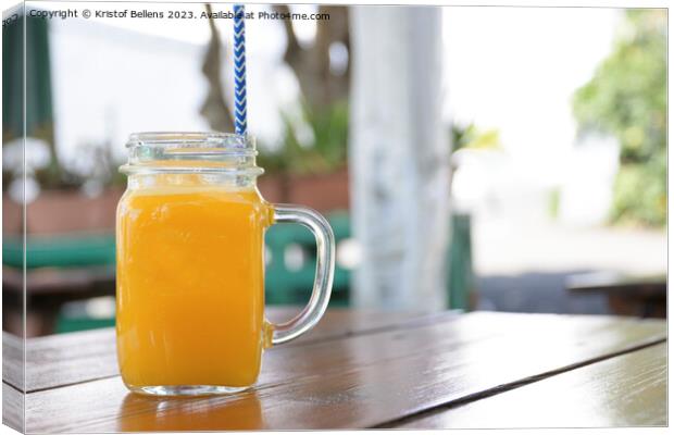 Horizontal shot of a jar of homemade orange juice Canvas Print by Kristof Bellens