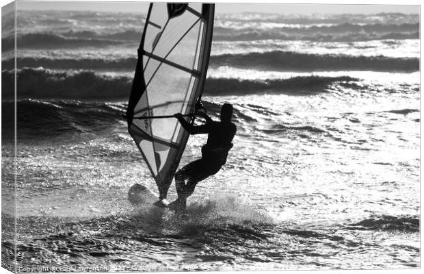 Wind surfer heads out to sea Canvas Print by Paul Lawrenson