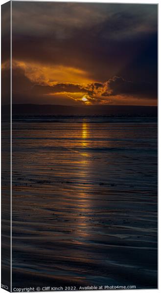 Long strands of sunset across the beach Canvas Print by Cliff Kinch