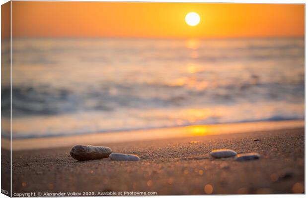Orange sunset on a calm sea and sandy beach and ra Canvas Print by Alexander Volkov