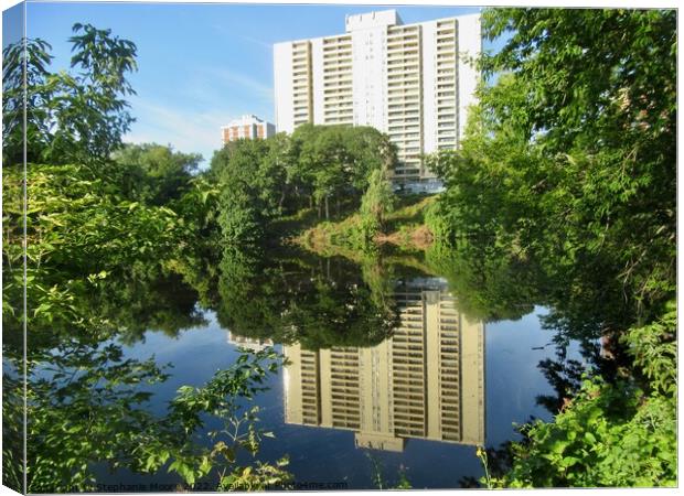 Reflection of an apartment building Canvas Print by Stephanie Moore