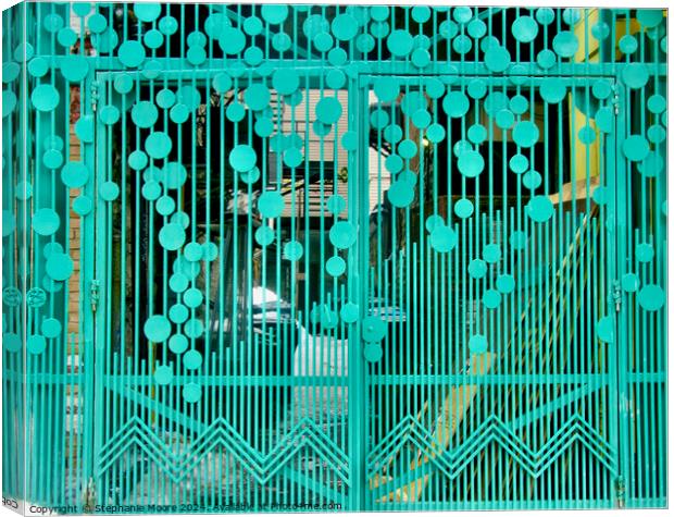 Green wrought iron gate Canvas Print by Stephanie Moore