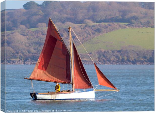 sailboat with red sails Canvas Print by Nik Taylor