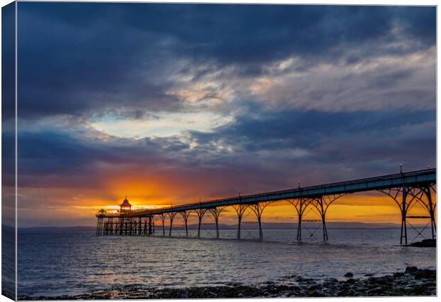 Clevedon Pier at sunset on a cloudy evening Canvas Print by Rory Hailes