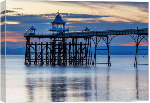 Clevedon Pier at sunset with reflection Canvas Print by Rory Hailes