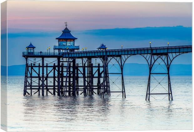 Clevedon Pier on a calm evening with a slight bluish hue Canvas Print by Rory Hailes
