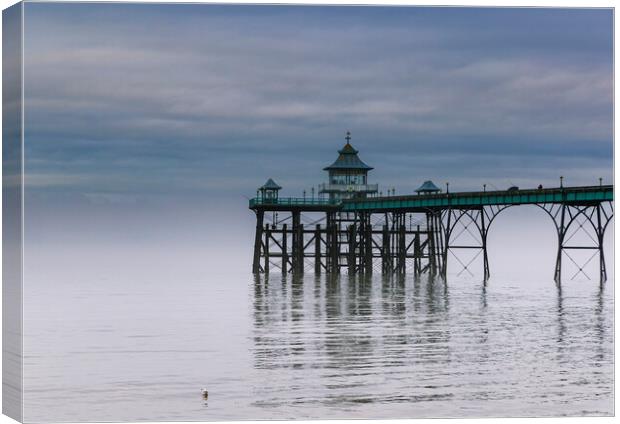 Clevedon Pier with the fog clearing Canvas Print by Rory Hailes