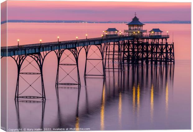 Clevedon Pier with its lights on Canvas Print by Rory Hailes