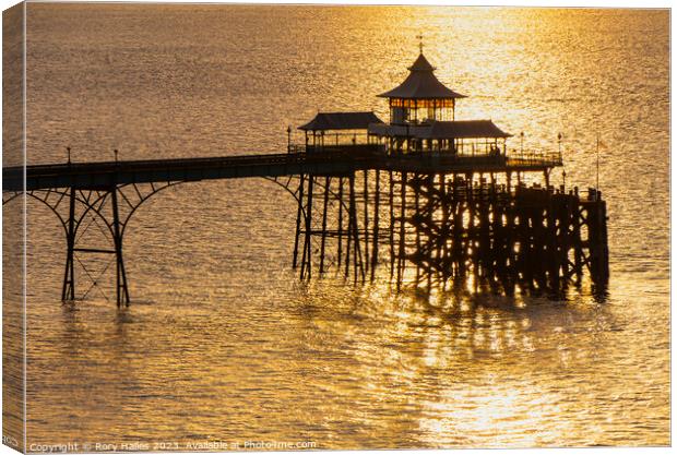 Clevedon Pier at sunset with a calm sea Canvas Print by Rory Hailes