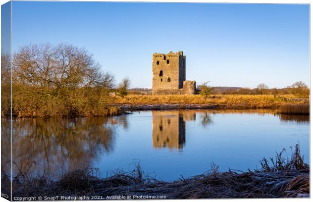Threave Castle reflecting on the River Dee in the winter sun and Canvas Print by SnapT Photography