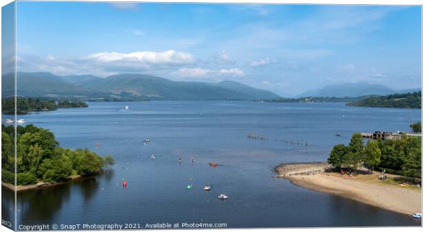 View over Loch Lomond from Lomond shores on a sunny summer day in Scotland Canvas Print by SnapT Photography