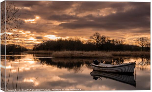 Sunset reflecting over the River Dee in Winter, with a boat in the river Canvas Print by SnapT Photography