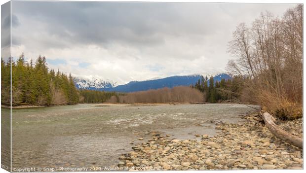 A cold Kalum River in Spring, with Mount Garland in the background Canvas Print by SnapT Photography