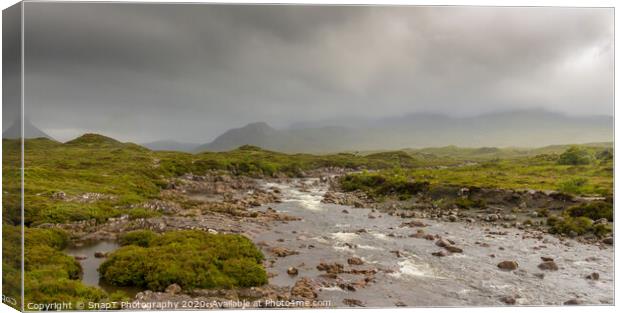 A fast flowing Scottish Highland river on a stormy day in the Isle of Skye Canvas Print by SnapT Photography