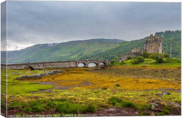 Looking out to Eilean Donan Castle on an overcast day in the Scottish highlands. Canvas Print by SnapT Photography