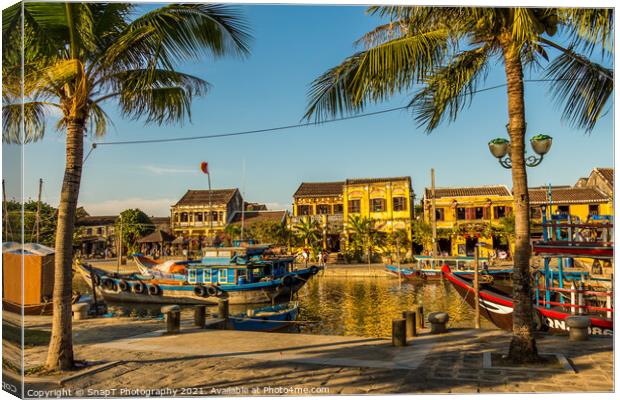 A view across the river from the south bank in Hoi An Vietnam, Canvas Print by SnapT Photography