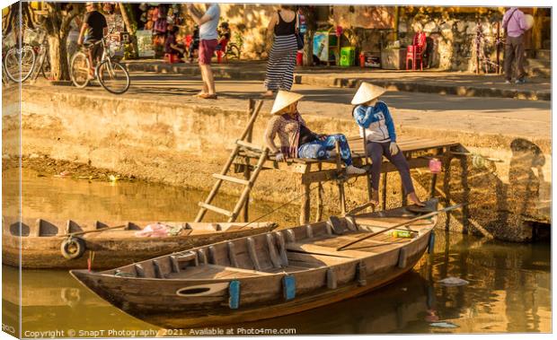 Two vietnamese ladies with conical hats relaxing by the river Canvas Print by SnapT Photography