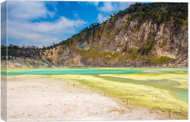 The yellow sulphur deposits and blue lake of Kawah Putih, Indonesia Canvas Print by SnapT Photography