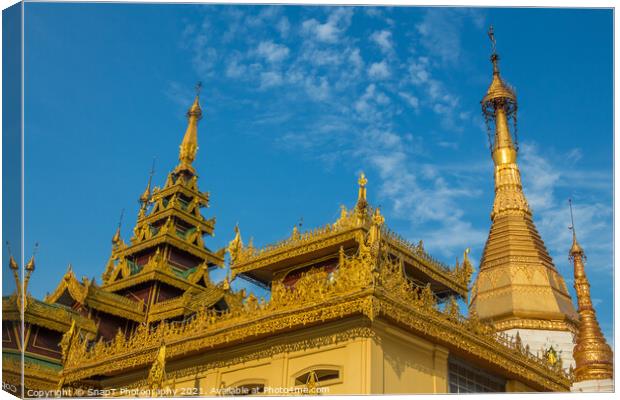 A golden buddhist temple in the evening sun in Yangon, Myanmar Canvas Print by SnapT Photography