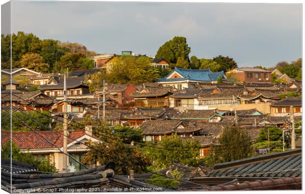 The Korean architechture in the roof tops of Bukchon Hanok Village in Seoul Canvas Print by SnapT Photography