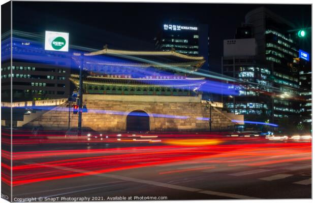 Long exposure of the traffic on the road at Sungnyemun Gate at night in Seoul Canvas Print by SnapT Photography