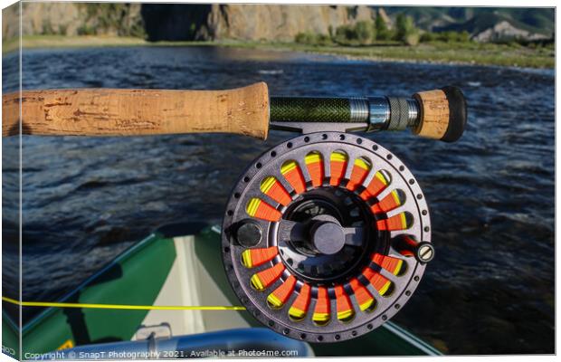 Close up of a fly fishing rod and reel in the late evening sun Canvas Print by SnapT Photography