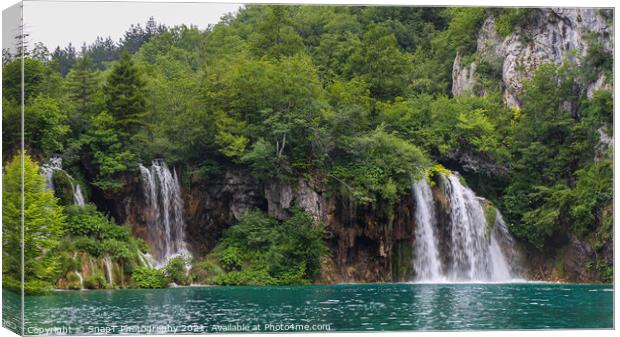 Two waterfalls flowing into a lake at Plitvice Lakes, UNESCO World Heritage Site Canvas Print by SnapT Photography