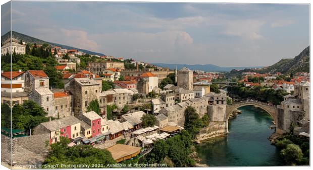 View over the old town of Mostar and the old bridge over the Neretva River Canvas Print by SnapT Photography