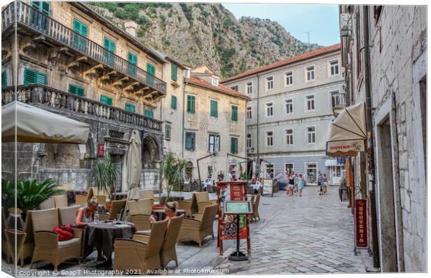 A cafe in a square at sunset, in the Old town of Kotor, Montenegro Canvas Print by SnapT Photography