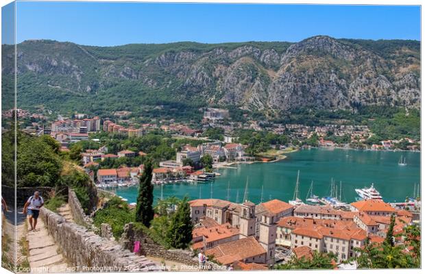 Tourists walking up the steps over looking the old town of Kotor, Montenegro Canvas Print by SnapT Photography