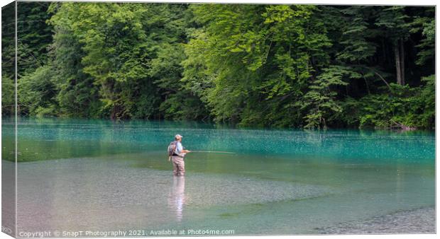 A man fly fishing for marble trout on the Soca River at Tolminka, near Tolmin, Slovenia Canvas Print by SnapT Photography