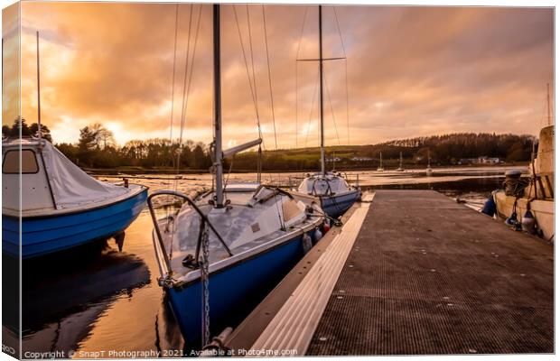 Yachts moored at Kirkcudbright marina at sunset in winter on the Dee estuary Canvas Print by SnapT Photography