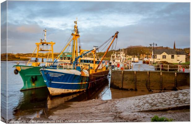 Fishing trawlers moored at Kirkcudbright harbour on the River Dee at sunset Canvas Print by SnapT Photography