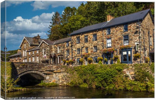 Beddgelert Snowdonia River and Buildings  Canvas Print by Phil Longfoot