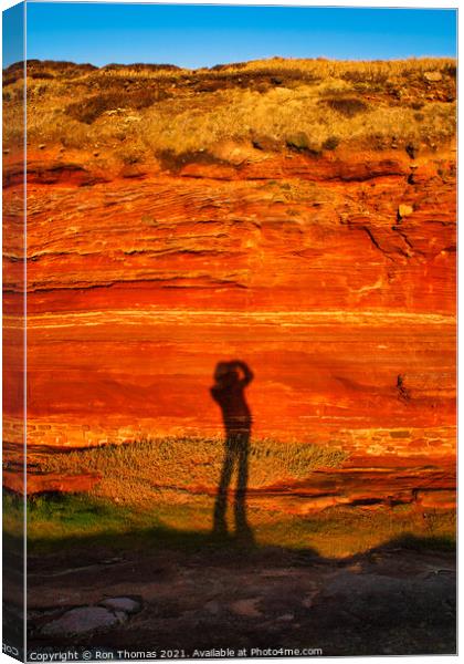 Photographer's Shadow on Sandstone Cliff Canvas Print by Ron Thomas