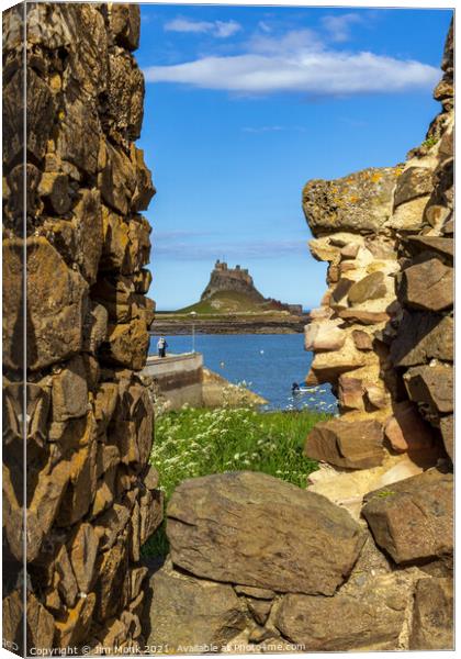 Lindisfarne Castle through the wall Canvas Print by Jim Monk