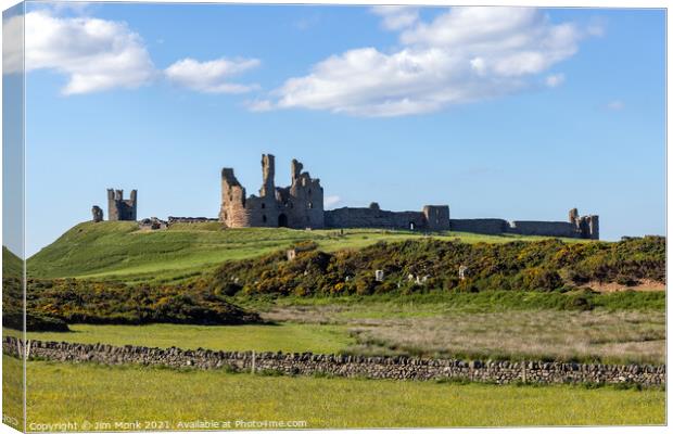 Dunstanburgh Castle in Northumberland Canvas Print by Jim Monk