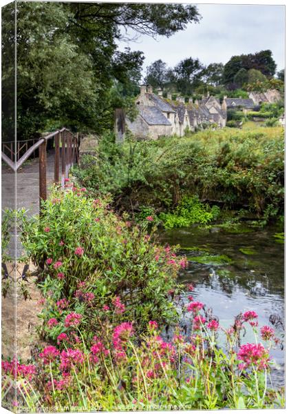  Bridge over the river Coln, Bibury Canvas Print by Jim Monk