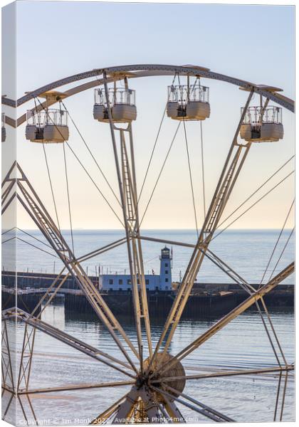 Wheel and Lighthouse, Scarborough Canvas Print by Jim Monk