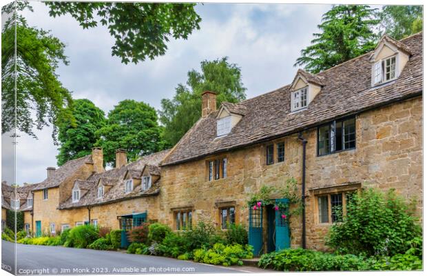 Idyllic Charm of Cotswold Stone Cottages Canvas Print by Jim Monk