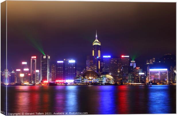 Hong Kong Island, Victoria Harbour waterfront including Hong Kong Convention and Exhibition Centre, and Central Plaza during A Symphony of Lights display. Canvas Print by Geraint Tellem ARPS
