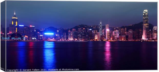 Hong Kong Island, Victoria Harbour waterfront including Hong Kong Convention and Exhibition Centre, and Central Plaza during A Symphony of Lights display. Canvas Print by Geraint Tellem ARPS