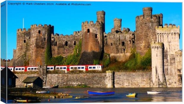Conwy Castle with a train going past. Canvas Print by Mark Chesters