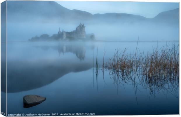 A misty sunrise on Kilchurn Castle  Canvas Print by Anthony McGeever