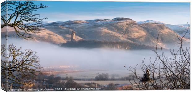 Wallace Monument and snow capped Ochil Hills  Canvas Print by Anthony McGeever