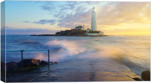 A golden sunrise at St Marys Lighthouse  Canvas Print by Anthony McGeever